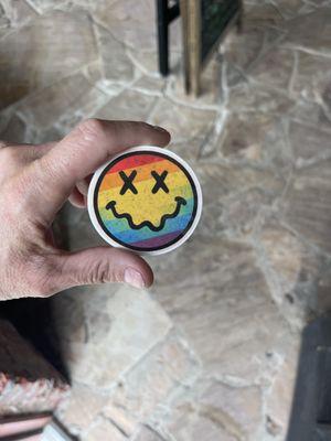 Rainbow smiley vinyl sticker.