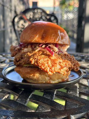 marinated organic chicken breast, brioche bun, vinaigrette slaw, pepper jack cheese, house pickles, remoulade, tangy house hot sauce