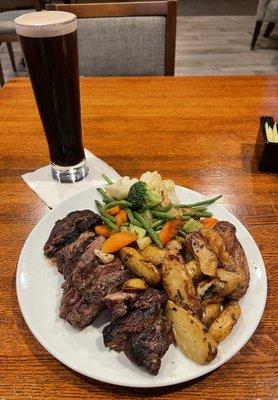 Steak dinner and a Guinness on draft.