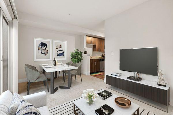 Staged living room with open-concept floor plan and sliding glass door.
