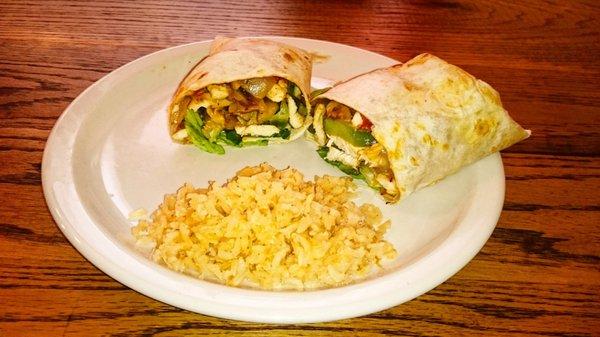 Try our Fajita Chicken Burrito- now with cheese sauce on top! Served with rice and beans.