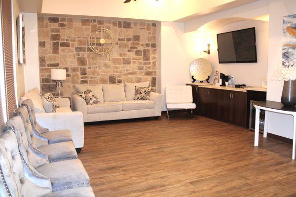 Relax in our comfortable waiting room with snacks, drinks and TV while you wait.