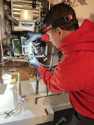 We service wall mount at boilers in this photo. We were actually performing a service on this specific equipment Navien boiler