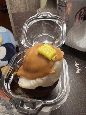 Chocolate Cupcake, decorated like a heap of mashed potatoes with gravy and a pat of butter.
