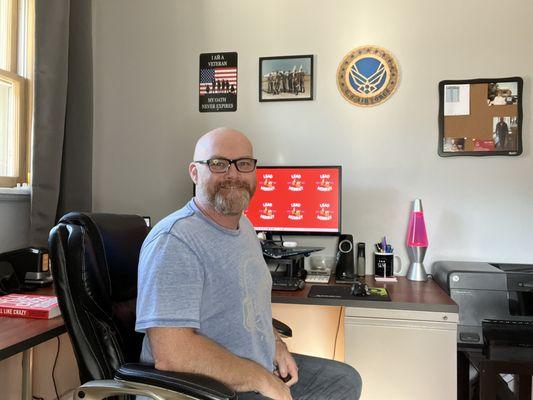 President of Lead Monkey Marketing preparing to get started on another website design project for a new client in my office.