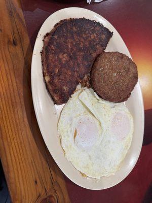 2 eggs over easy, sausage patties and corn beef hash