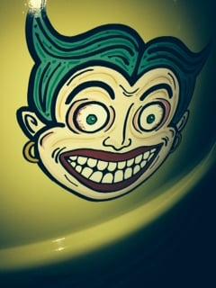 hand lettered joker face