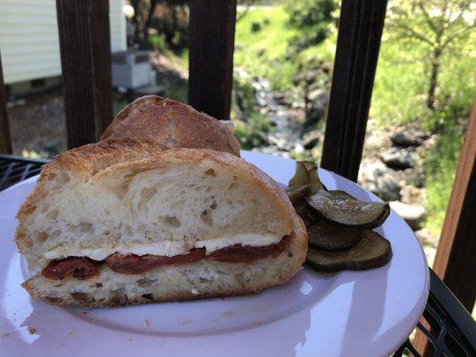 Roasted tomato and Brie on french bread with house made pickles