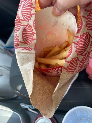 Half empty box of fries