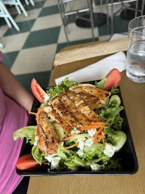 Summer mixed green salad. Garden greens, cucumber, carrot, tomato, goat cheese and creamy maple vinaigrette