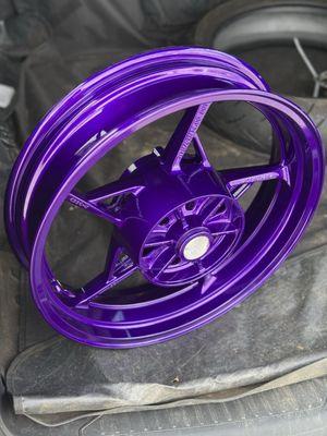 After: purple powder coated motorcycle rim