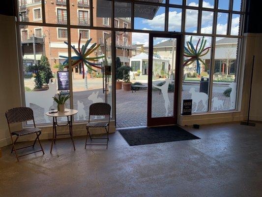 Front door looking out on park and seating area