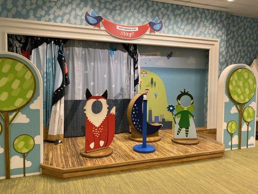 Fun stage for pretend play. Apparently there are different curtains for different backgrounds as well