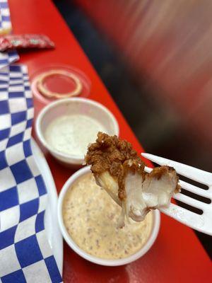 Dipping those tenders in some comeback sauce and garlic sauce!
