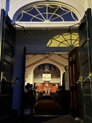 Through the open front door on a warm spring night at the Me&Thee