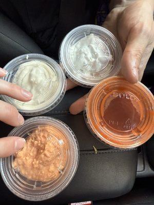 Garlic Aoili(top left) Tzatziki (top right) Spicy Feta Sauce (bottom left) Hot Sauce (bottom right)
