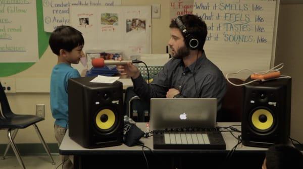 Lawrence Grey making music with 2nd graders at an LA Charter School.