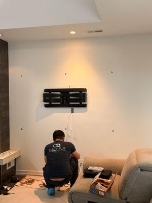 Running the wires behind the wall.