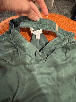 Lunya silk pajama pants that have ripped at the seams.