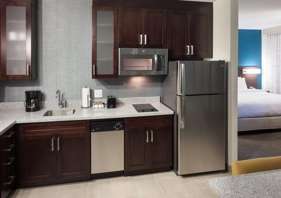 Each suite features a fully-equipped kitchen with stainless steel appliances, cookware and utensils.
