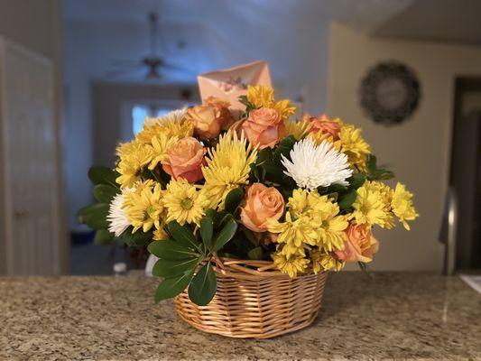 Floral arrangement with basket