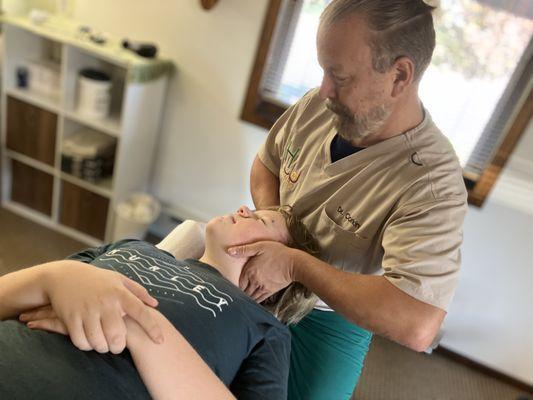 Dr Mark Corkin providing neck (cervical spine) adjustments at Healthworks in Manasquan for Monmouth and Ocean County, New Jersey.