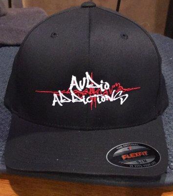 Beautiful embroidery on a black flexfit cap.