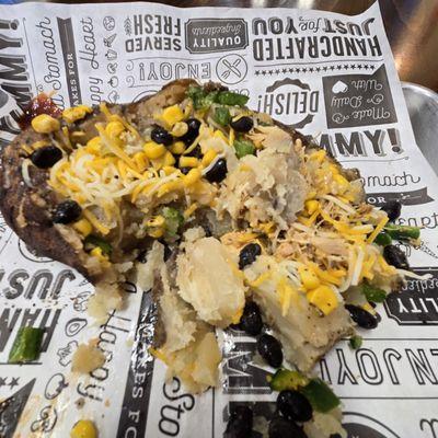 Tex Mex Loaded Potato broken up to be devoured