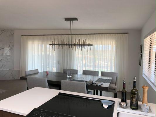 Sheers add soft, timeless luminescence to any dining area.