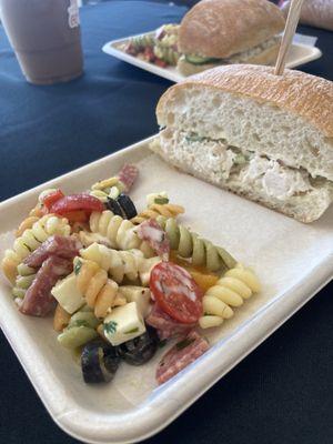 Chicken salad sandwich homemade on a soft ciabatta roll the homemade pasta salad