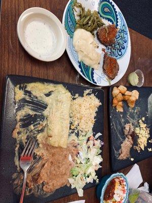 Green Chile chicken enchiladas, scrambled eggs with sausage, fried potatoes and refried beans and a complimentary meatloaf plate.