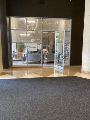 Store front located directly inside main entrance to 900 N Kingsbury St.