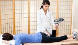 Physical Therapist helping a patient