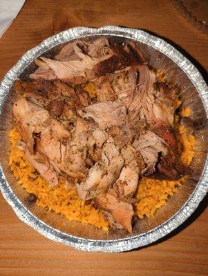 Pernil and yellow rice and beans. Really delicious. Only $10.