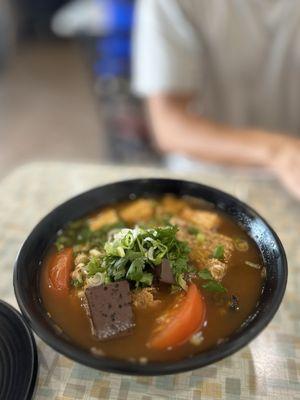 08. Bun Rieu Oc: Special shrimp soup served with small rice vermicelli, fried tofu, pork blood shrimp cake & snail | $16