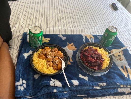 Sesame chicken and boneless ribs both with yellow rice