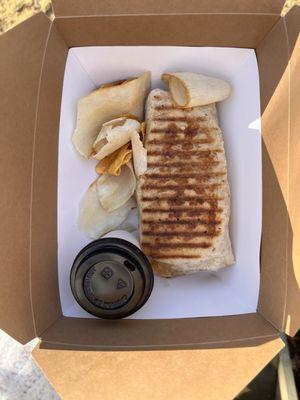 Breakfast burrito with Hash brown, "cheese", Just Egg, & Impossible meat with a side of hot sauce, plantain and yuca chips!