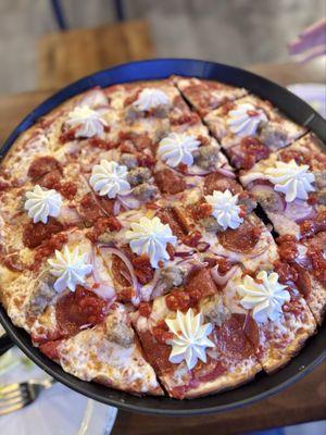 Calabrian | Tavern Style Pizza (gluten friendly); Marinara sauce, mozzarella, sausage, pepperoni, red onion, ricotta and Calabrian chilis.