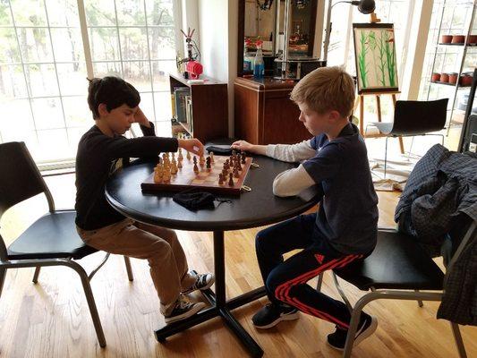 Students playing chess.