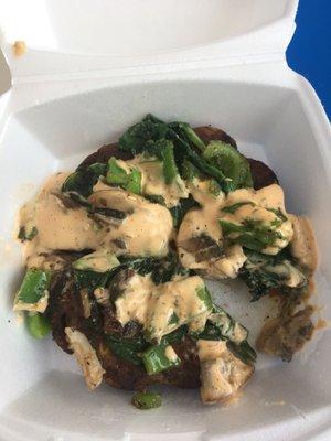 Black bean burger with sautéed spinach, mushrooms, and bell peppers with chipotle ranch on top.