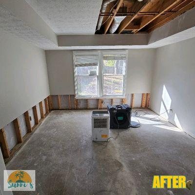 The affected drywall ceiling, flooring, and baseboards were removed, and flood cuts were made to allow remediation and proper drying.