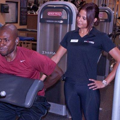 Owner of Q|K Lifestyle training a member.