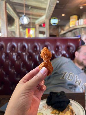 The Hand-breaded cheese curds are amazing! the boneless wings were also really good and my camera shy husband liked the Rachel.