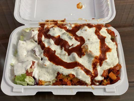 Chicken Rice Platter, with white sauce and hot sauce.