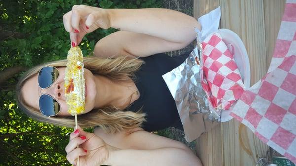 Elote (corn on the cob) with mayo, queso, and hot sauce