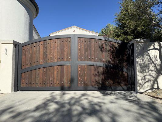 New driveway gates metal frame and wood inserts custom design in Ladera Ranch by OC Gates.
