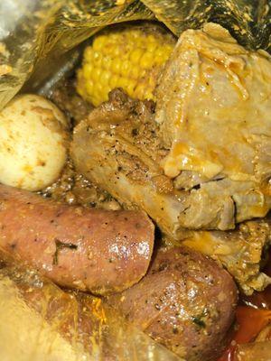 Boom Bag 9#/ 2 Cajun Turkey Necks, 1 Corn, 1 Egg, 1 Sausage, & 1 Potato (due to size it was cut into 4 pieces).