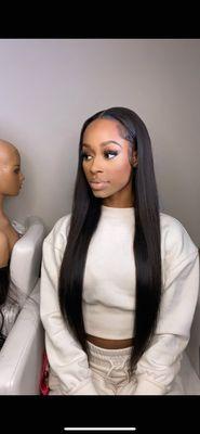 Taylor, Master Hairstylist wearing a Traditional Sew In