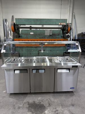 Custom NSF approved sneeze guard fabricated for a self service sandwich table