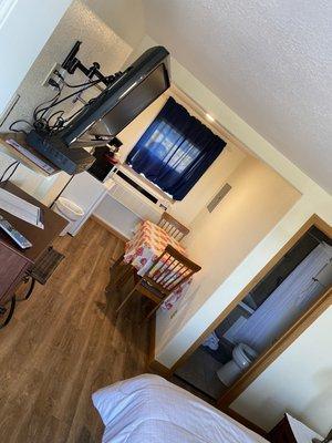 Mounted TV with a cute little kitchen area- includes a fridge & microwave